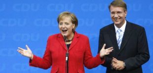 Merkel anunciando a s&uacute;a vitoria